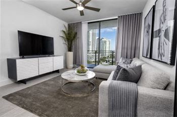 A living room filled with furniture and a flat screen tv